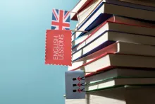 English learning books stacked on a table