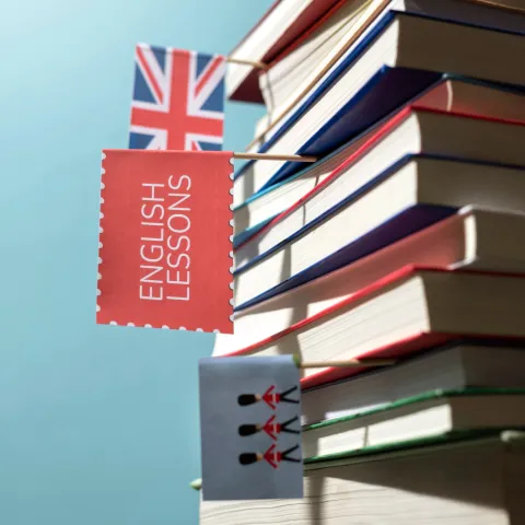 English learning books stacked on a table