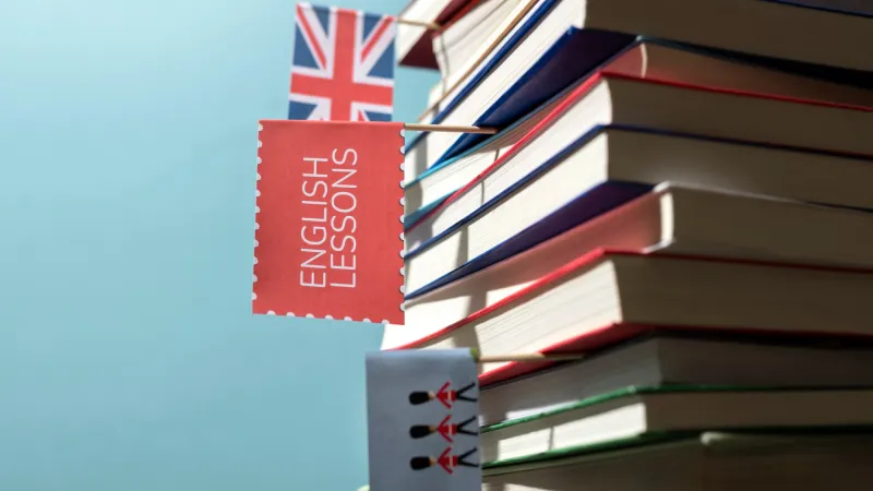 English learning books stacked on a table